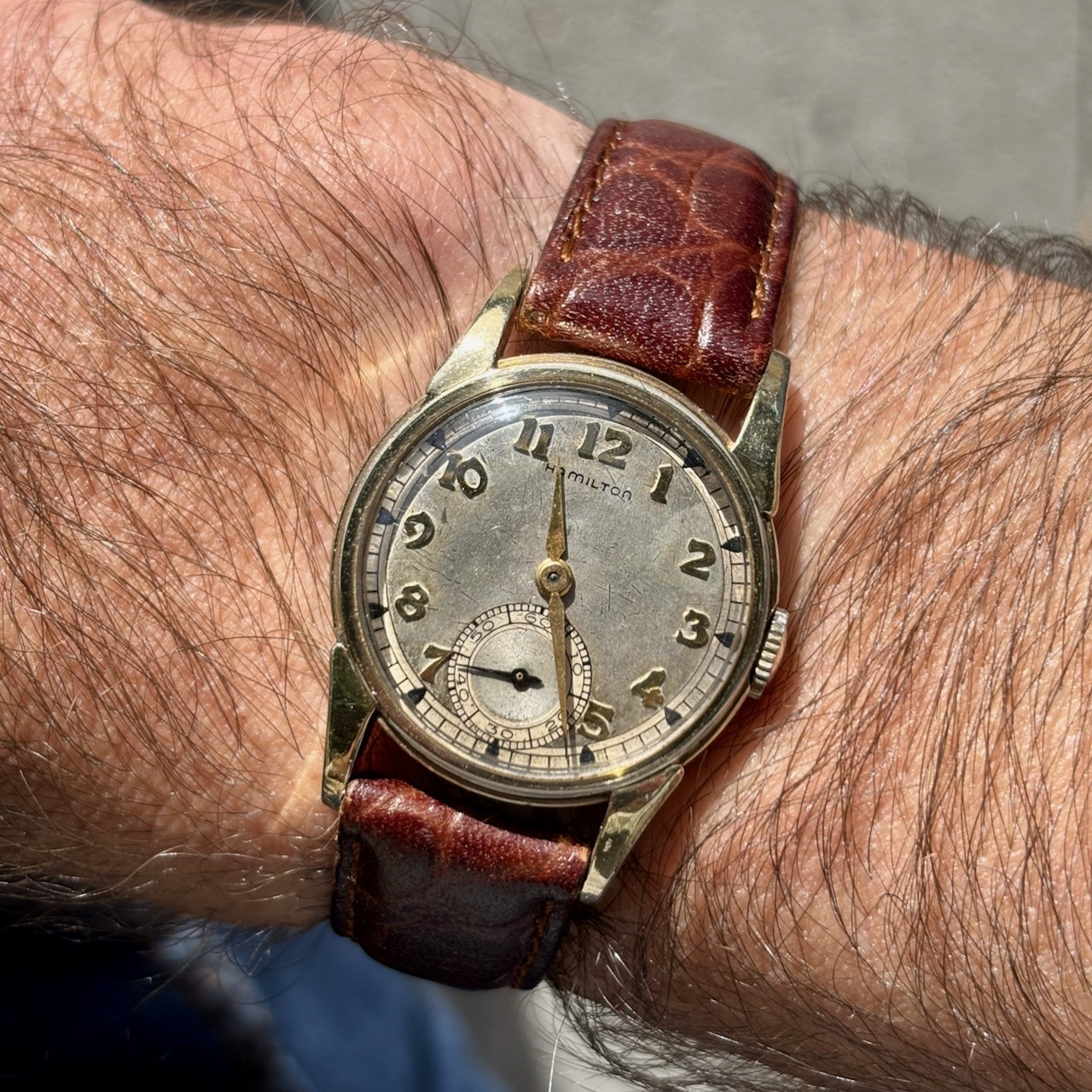 The Black Bay 58 Blue on a hike overlooking Lake Tahoe from a snow-capped mountain.